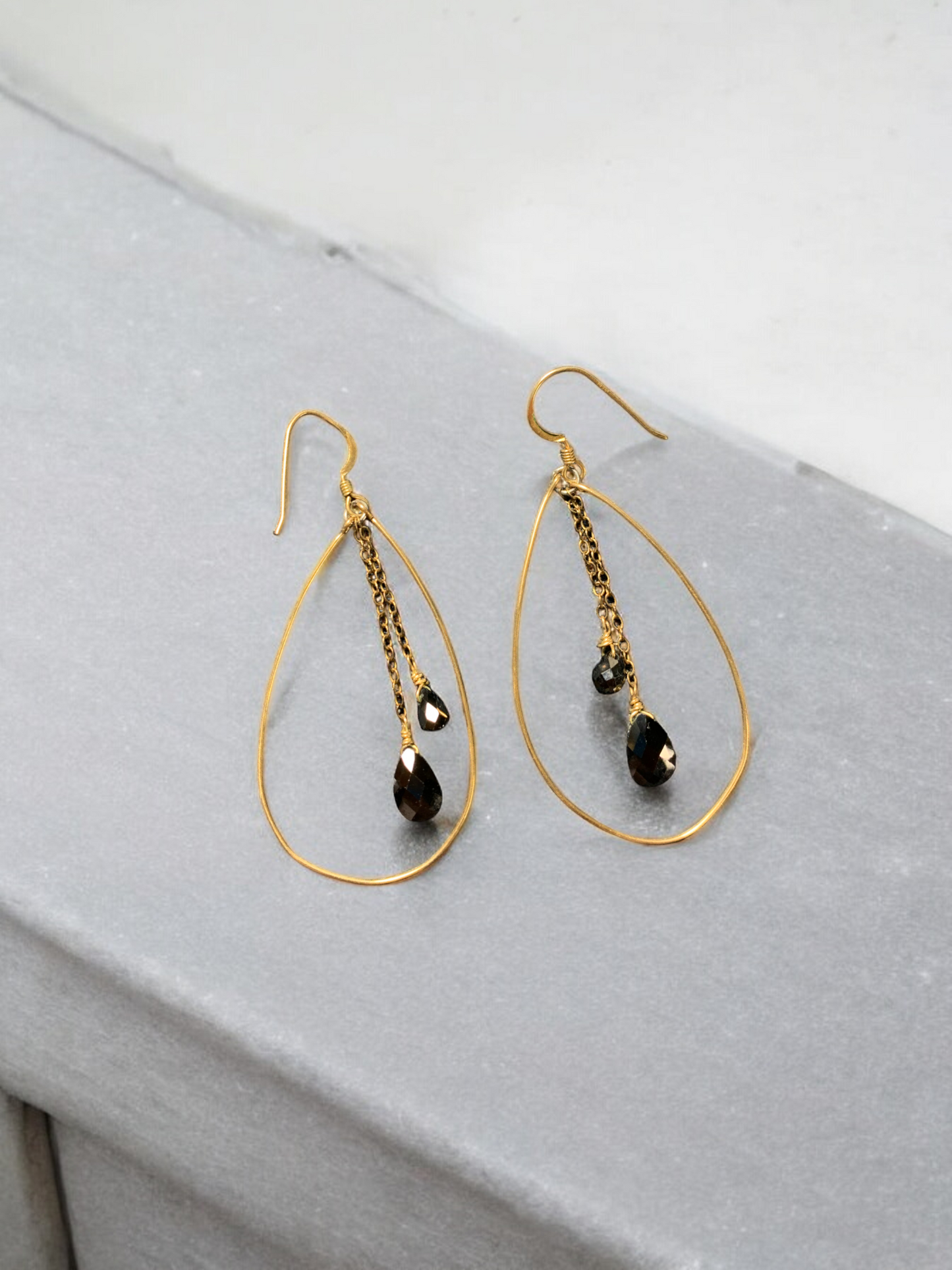 Gold and black color hoop earrings