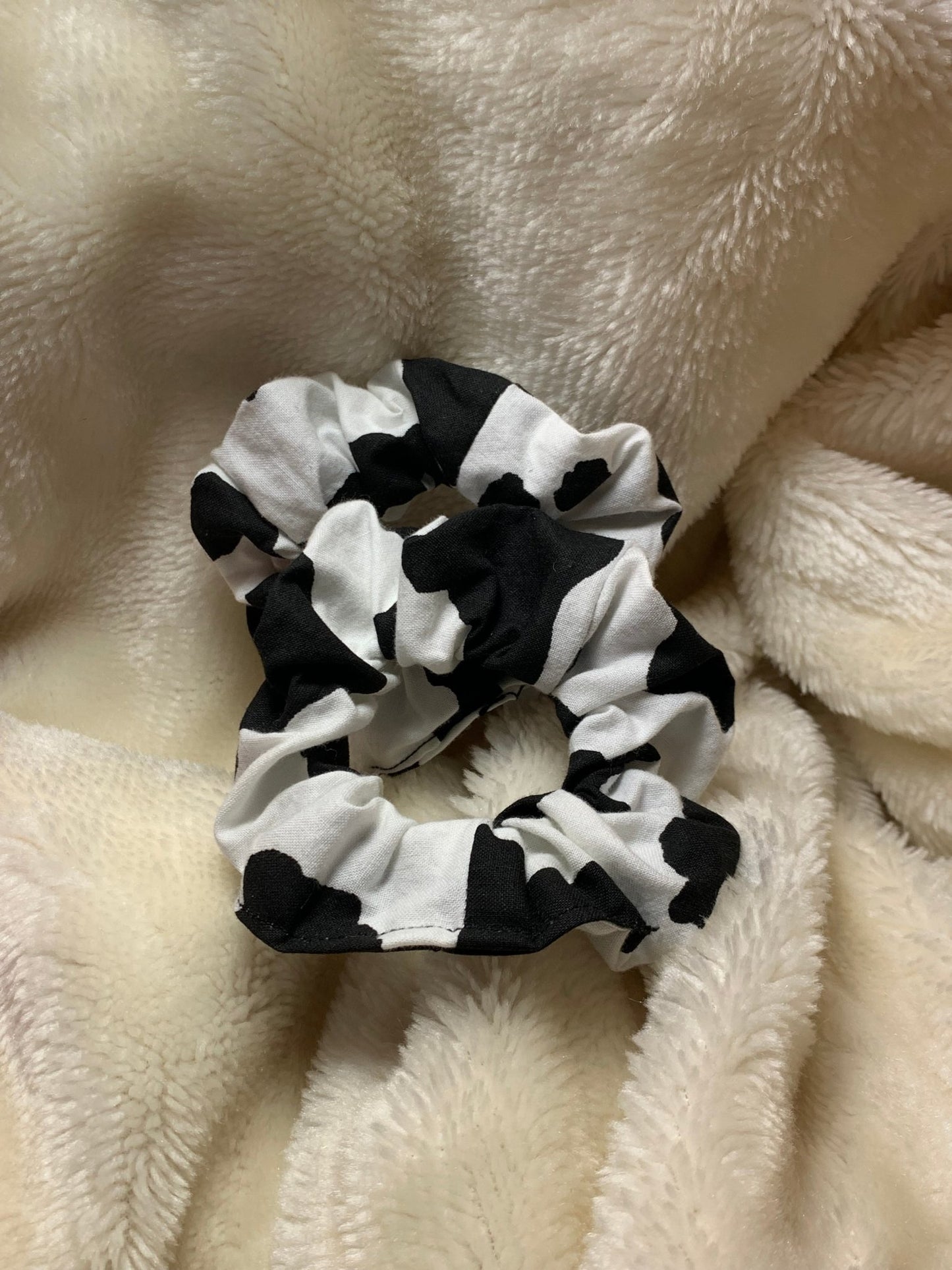 Handmade cow print mini scrunchies for toddler